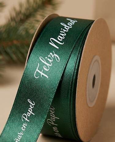 Rollo de cinta de satén verde con Feliz Navidad en blanco