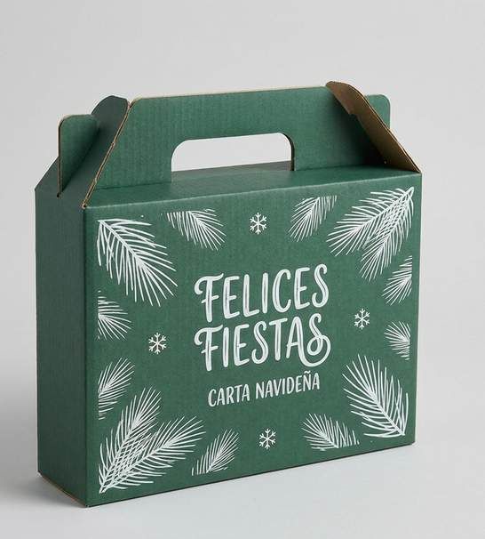 Caja verde con asa, ramas blancas y el texto Felices Fiestas